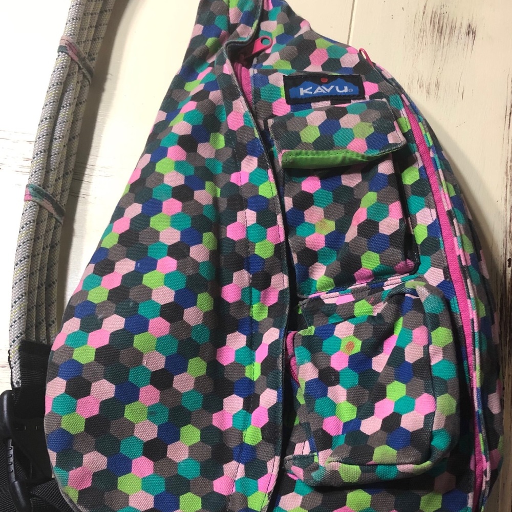Polka dotted crossbody Kavu bag.